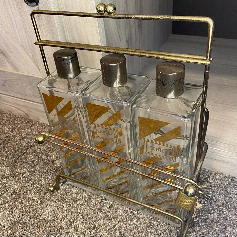 Vintage Decanter with Caddy, three bottle tantalus w Scotch, Bourbon Gin Labels